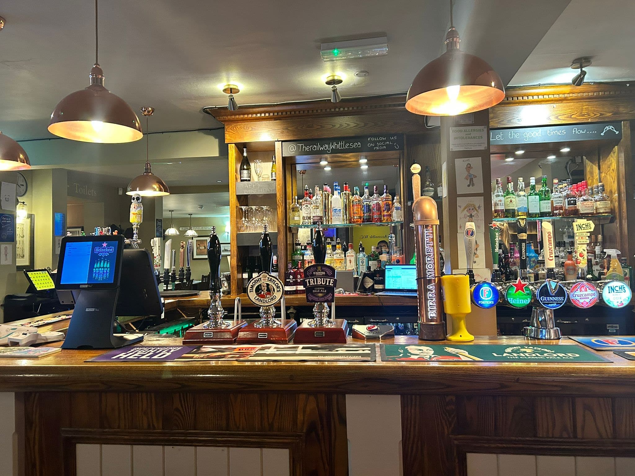 The Railway Pub main bar area with beer taps